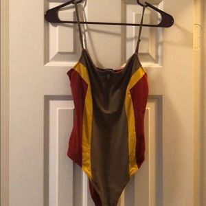 Olive, mustard, and dark red body suit